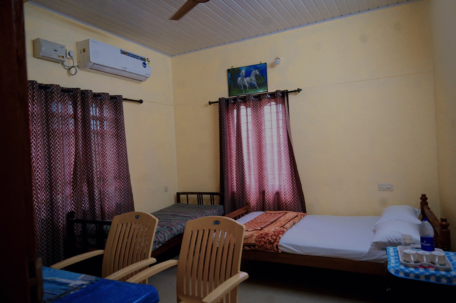 Twin bed bedroom with wooden furniture, non air-conditioned